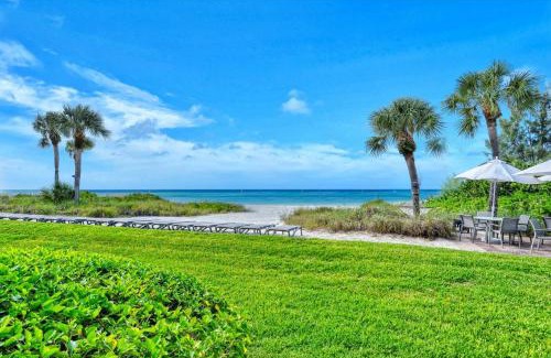Longboat Key Apartment | LaPlaya 101A Step out to the beach from your screened lanai Light and bright end unit