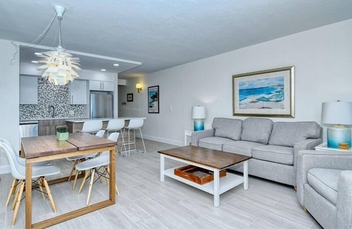 Longboat Key Condo | LaPlaya 101A - Step out to the beach from your screened lanai. Light and bright end unit.