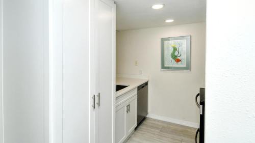Longboat Key Apartment | LaPlaya 104E Perfectly located near the path to the beach just steps from the pool