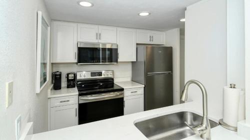Longboat Key Apartment | LaPlaya 104E Perfectly located near the path to the beach just steps from the pool