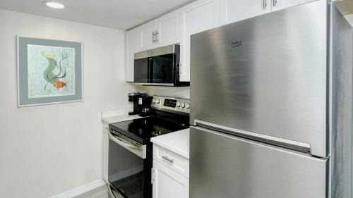 Longboat Key Apartment | LaPlaya 104E Perfectly located near the path to the beach just steps from the pool