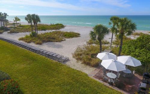 Longboat Key Apartment | LaPlaya 201C Breathtaking Gulf panorama from this corner end unit with a private stairway to the beach