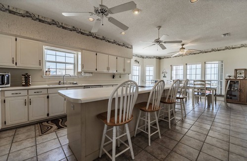 Dauphin Island House | Large Bayfront Home on sandy Bay beach with large screened porch.