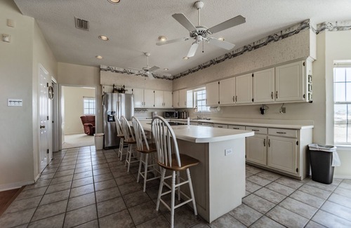 Dauphin Island House | Large Bayfront Home on sandy Bay beach with large screened porch.