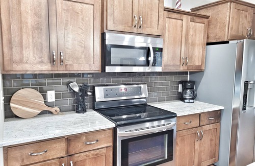 Arnolds Park Cabin | LARGE floorplan, 4 private bedrooms, flexble check-in, comfy beds, kid-friendly!