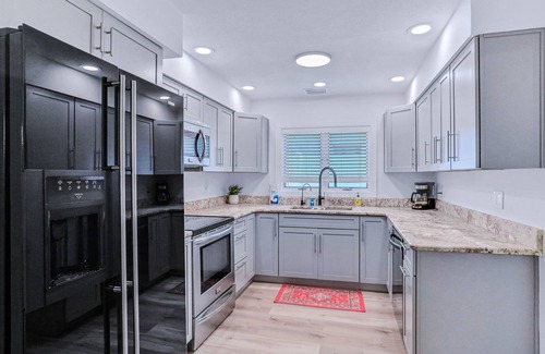 Seminole House | Large heated pool home with backyard oasis, dog friendly, AC and Wifi