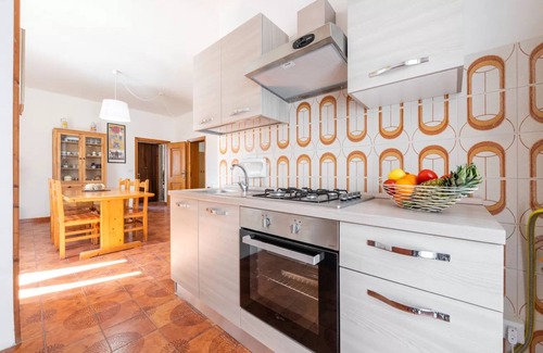 Lu Bagnu Apartment | Large seaside apartment with patio in Lu Bagnu