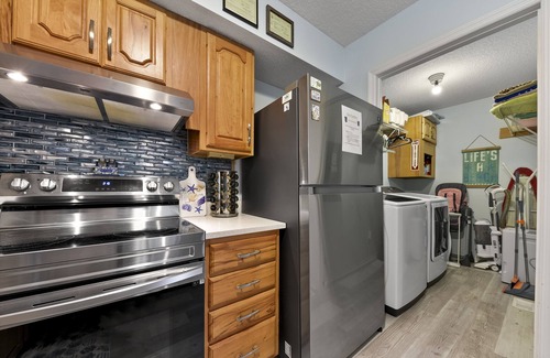 Fernandina Beach House | Latitude Adjustment-One block from the beach, shared pool, one dog allowed.