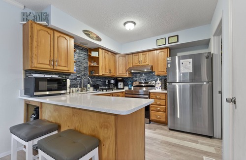 Fernandina Beach House | Latitude Adjustment-One block from the beach, shared pool, one dog allowed.