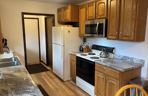 Cadillac House | Lazy Acorn "The Yellow Perch" on Lake Mitchell