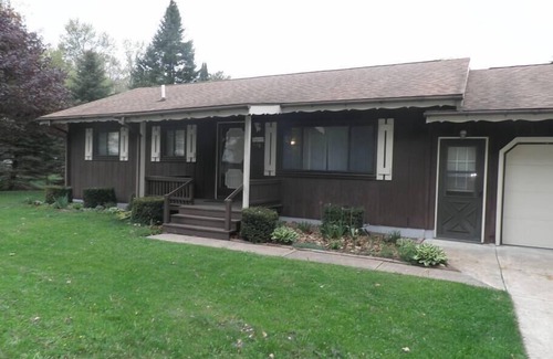 Cadillac House | Lazy Acorn "The Yellow Perch" on Lake Mitchell
