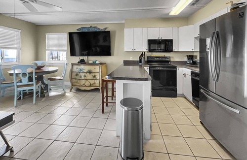 SeaNest Village Condo | "Leeward II-3" | Beachfront Condo | Large first level deck with steps down to sand