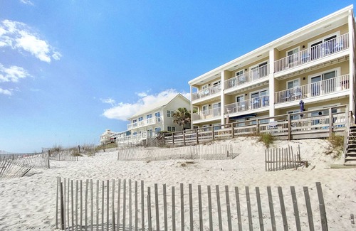 SeaNest Village Condo | "Leeward II-3" | Beachfront Condo | Large first level deck with steps down to sand