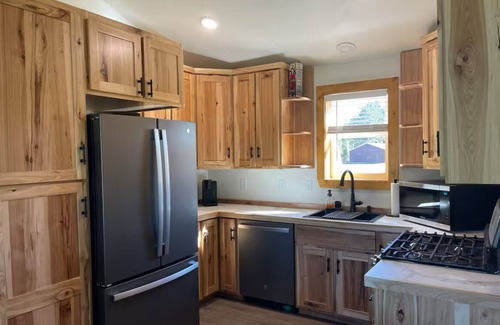 Jim Falls House | Legacy farm waterfront cottage in welcoming Eau Claire with WiFi, AC