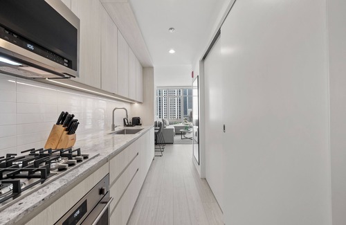 West Loop Hotel | Level - Fulton Market Junior Two Bedroom Two Bath suite with kitchen and balcony