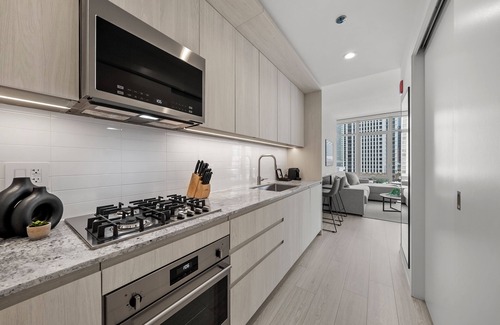 West Loop Hotel | Level - Fulton Market Junior Two Bedroom Two Bath suite with kitchen and balcony