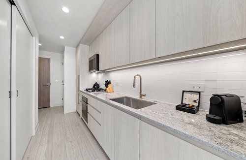West Loop Hotel | Level - Fulton Market Junior Two Bedroom Two Bath suite with kitchen and balcony