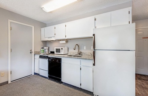 Orchard District Apartment | "License to Mill" Downtown Corner Studio with 270-degree Riverview