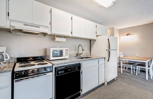 Orchard District Apartment | "License to Mill" Downtown Corner Studio with 270-degree Riverview