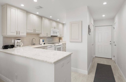 Marco Island Condo | Light and Bright Walk to the Beach Condo