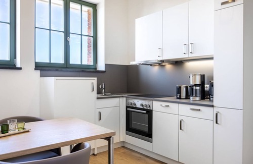 Wismar Apartment | Light-flooded harbor apartment with panoramic view, roof terrace and balcony