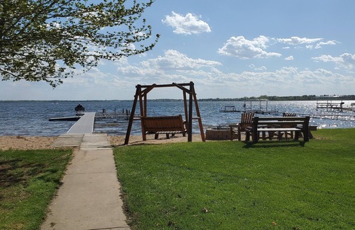 Shawano Cottage | Lilly Pad North, Cottage #4 is on Shawano Lake, nestled among 4 other cottages. Beautifully located. Relaxing days on the beach and sunsets by the firepit are the best.