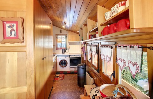 Verbier Apartment | Living room with fire place, kitchen with vitroceram, dishwasher, microwave and washingmachine, eati