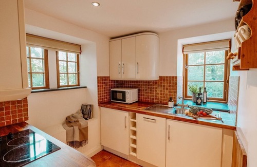 Llanddeusant Cottage | Llynon Lodge - a cosy fire that sleeps 4 guests in 2 bedrooms