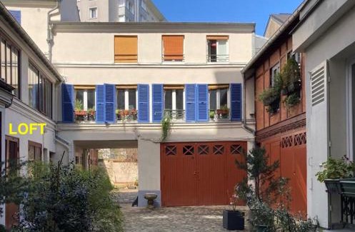 19th Arrondissement Apartment | Loft character with a view of court