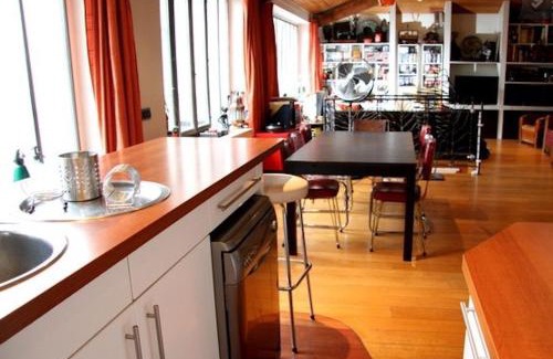19th Arrondissement Apartment | Loft character with a view of court