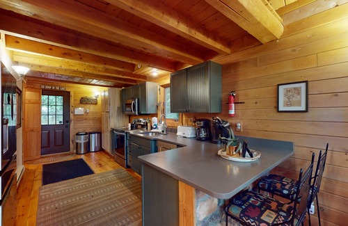 McHenry House | Log cabin in forested setting with private hot tub & amazing views, dog-friendly