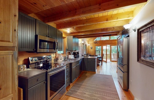 McHenry House | Log cabin in forested setting with private hot tub & amazing views, dog-friendly
