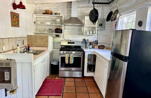 San Cristobal House | Log Casita Overlooking Pond and Waterfall near Taos, New Mexico