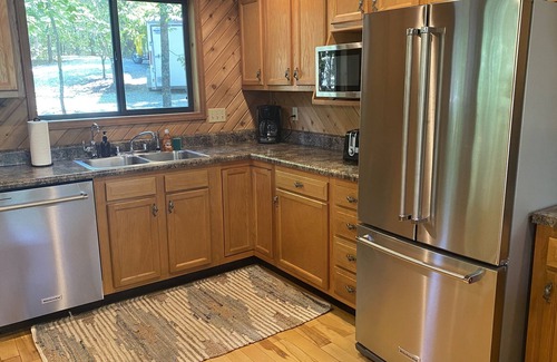 Innsbrook Ski Chalet | Longhorn Lakeside Chalet by Sarah Bernard, Private Dock and Fire Pit