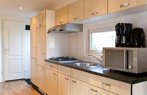Schaarsbergen House | Lovely apartment in villa for 4 guests with WIFI, pool, TV and terrace