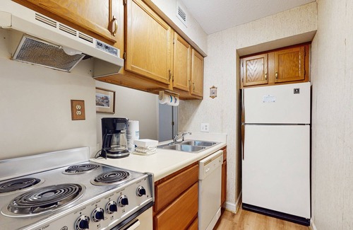 Chalet Village Condo | Lovely condo w/free attraction tickets, outdoor pool, fireplace & balcony