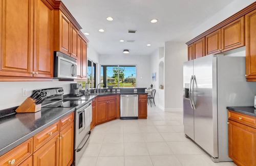 Cape Coral House | Lovely! Heated Pool & Canal Front! SE Cape Coral! Free Kayaks & Over $125 of Free Daily Activities!