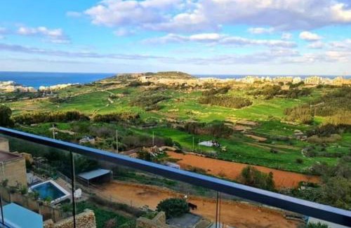Xaghra Apartment | Lovely home with beautiful view with communal pool by 360 Estates