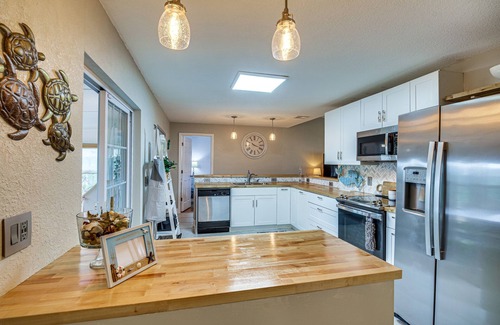 Surfside Estates House | Lovely Merritt Island Home w/Kayak + Fire Pit!