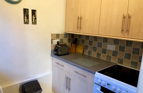 Cornhill on Tweed Cottage | Lovely quiet cottage overlooking the Cheviot Hills, real fire, private gardens