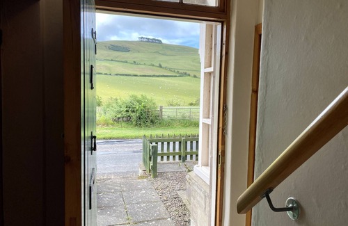 Cornhill on Tweed Cottage | Lovely quiet cottage overlooking the Cheviot Hills, real fire, private gardens