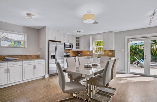Coral Heights House | Lovely Vacation Home with a tropical private yard and heated pool near the Beach