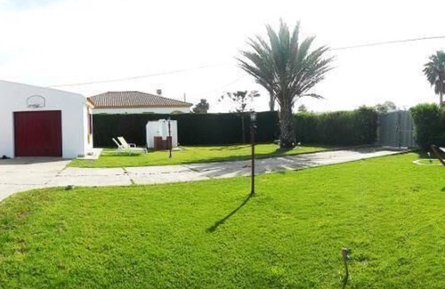 El Palmar House | Lovingly furnished holiday house, 250m from the sea, large garden, roof terrace