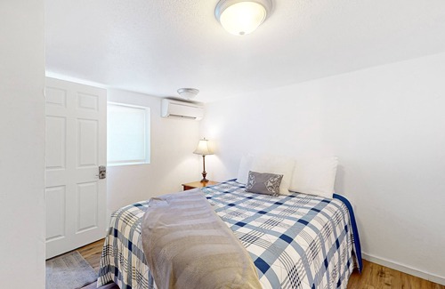 Haller Lake House | Lower-level home with spacious fenced backyard, playground, BBQ, firepit