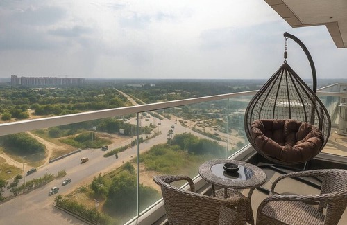 Gurugram Apartment | Lush Comfort Studio with Balcony Views