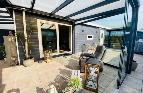 Lathum Ski Chalet | LuxChalet vacation home ELLA view on Ijssel in vacation park Pool Strand Holland