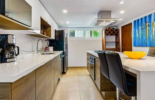 Las Glorias Apartment | Luxe beachfront condo with balcony, multiple pools, ocean views, & WiFi