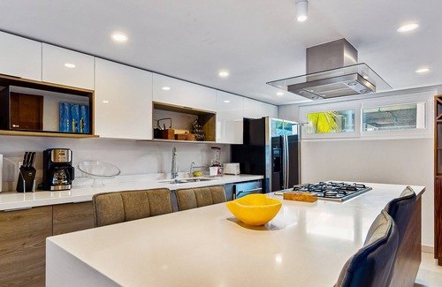 Las Glorias Apartment | Luxe beachfront condo with balcony, multiple pools, ocean views, & WiFi