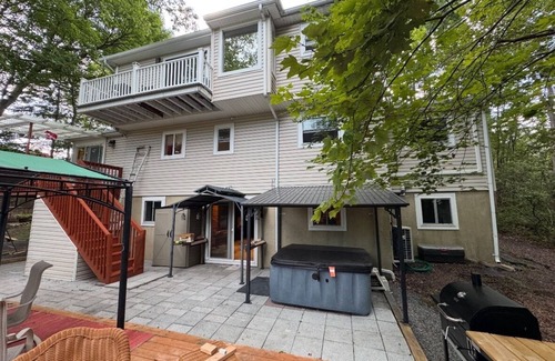 Long Pond House | Luxe Pocono Oasis! Hot Tub, Firepit, Sauna, Lake, Ski, BBQ, Game Room, Fireplace