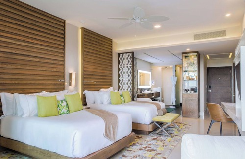 Puerto Juarez Hotel | Luxurious 2-bedroom swim-up suite at Garza Blanca's 5 Diamond Resort.